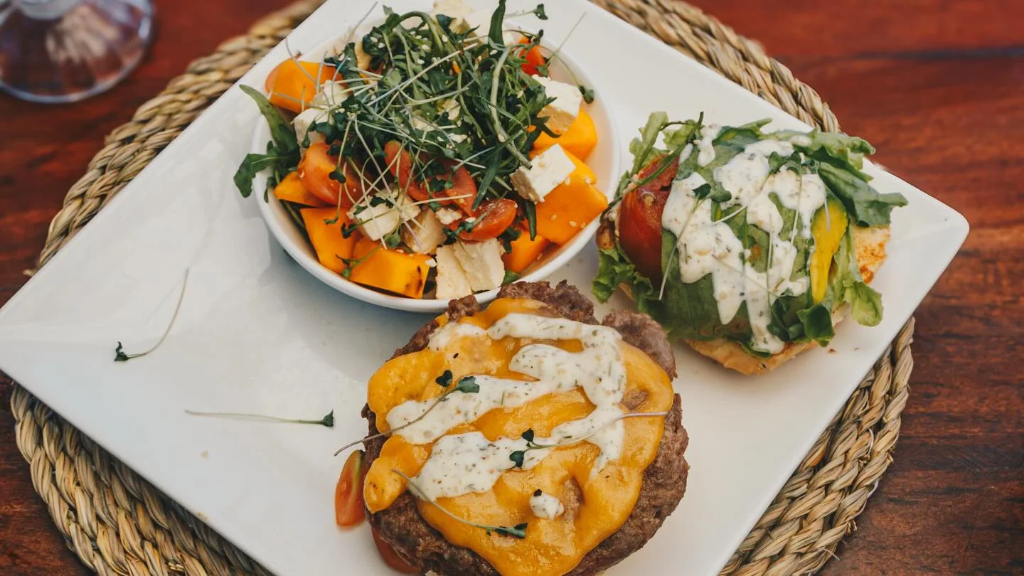 Juicy burger with fresh salad