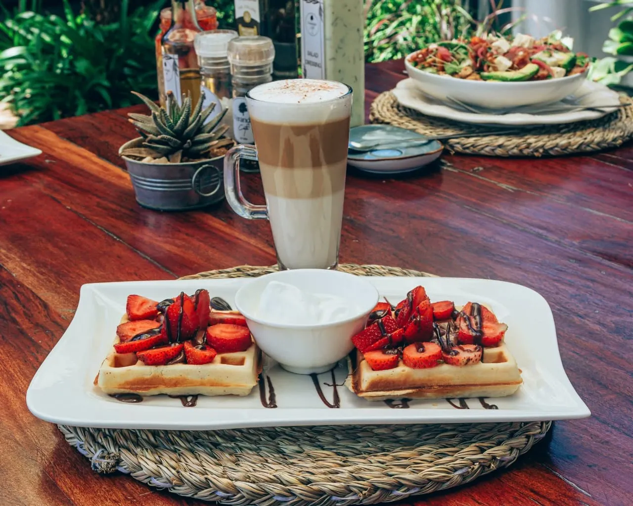 Latte with waffles and strawberries
